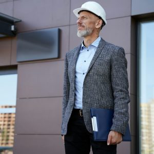 monitoring-the-progress-focused-middle-aged-architect-engineer-manager-wearing-helmet-looking.jpg